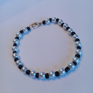 Faux pearl and black beaded bracelet